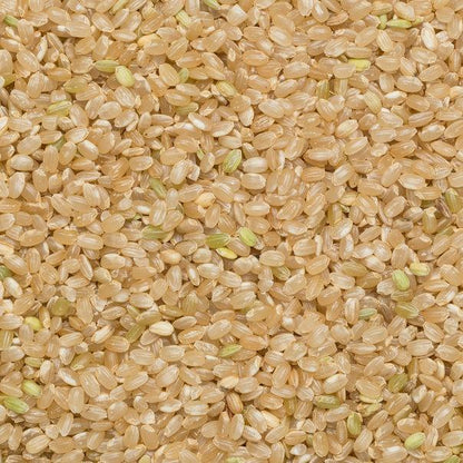 Whole Food Earth short grain brown rice, GMO-free, natural, vegan, dairy-free, in a clear bag, ready for cooking and healthy meals.