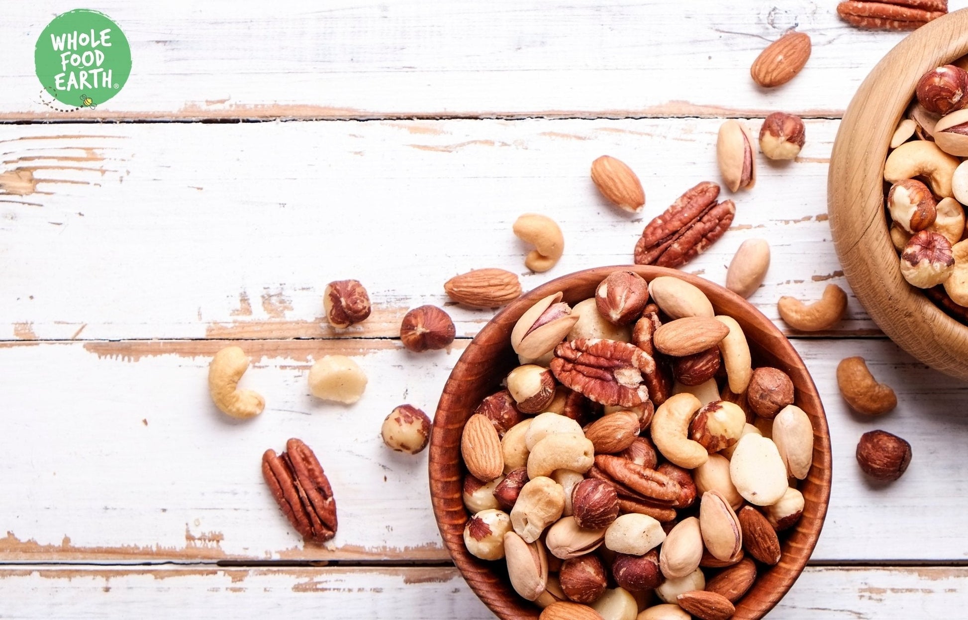 Mixed nuts and seeds from Whole Food Earth, super deluxe blend, GMO-free, vegan, dairy-free, no added sugar, healthy snack option.