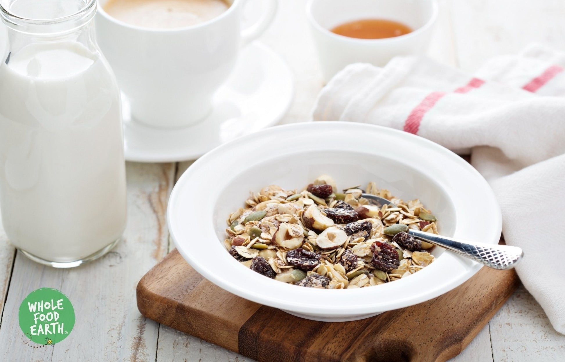 Whole Food Earth Super Deluxe Muesli with whole nuts, dried fruit, seeds, and flakes in a natural, wholesome cereal blend.