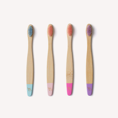 Children's Wild And Stone bamboo toothbrushes in candy colors, 4-pack, eco-friendly toothbrushes for kids with colorful bristle designs.