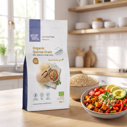 Organic quinoa grain from Whole Food Earth, displayed in a natural setting with a bowl of cooked quinoa and raw grains.
