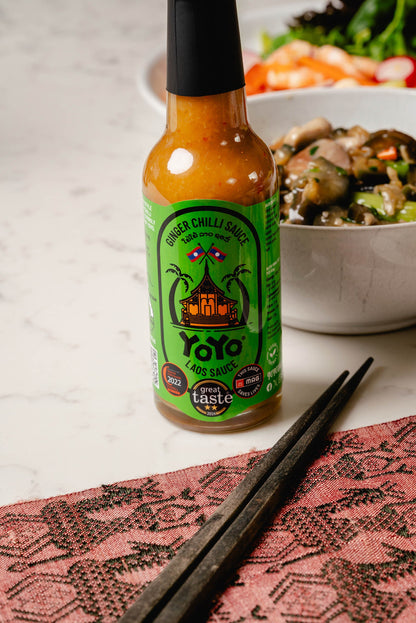 Bottle of YoYo Laos Signature Ginger Chilli Sauce with vibrant label, showcasing the spicy ginger and chilli flavor.