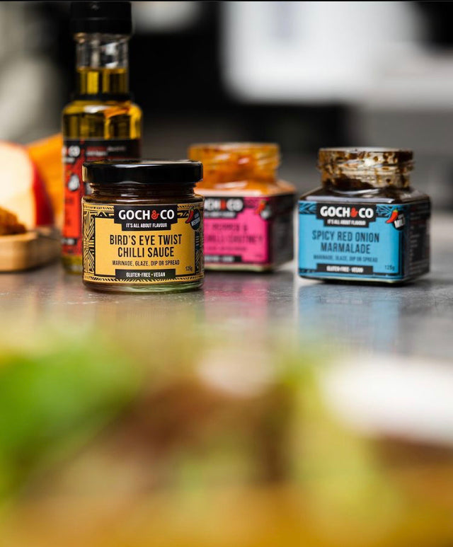 Goch & Co BBQ sauces gift set featuring assorted authentic-flavored bottles in a gift box with vibrant labels.