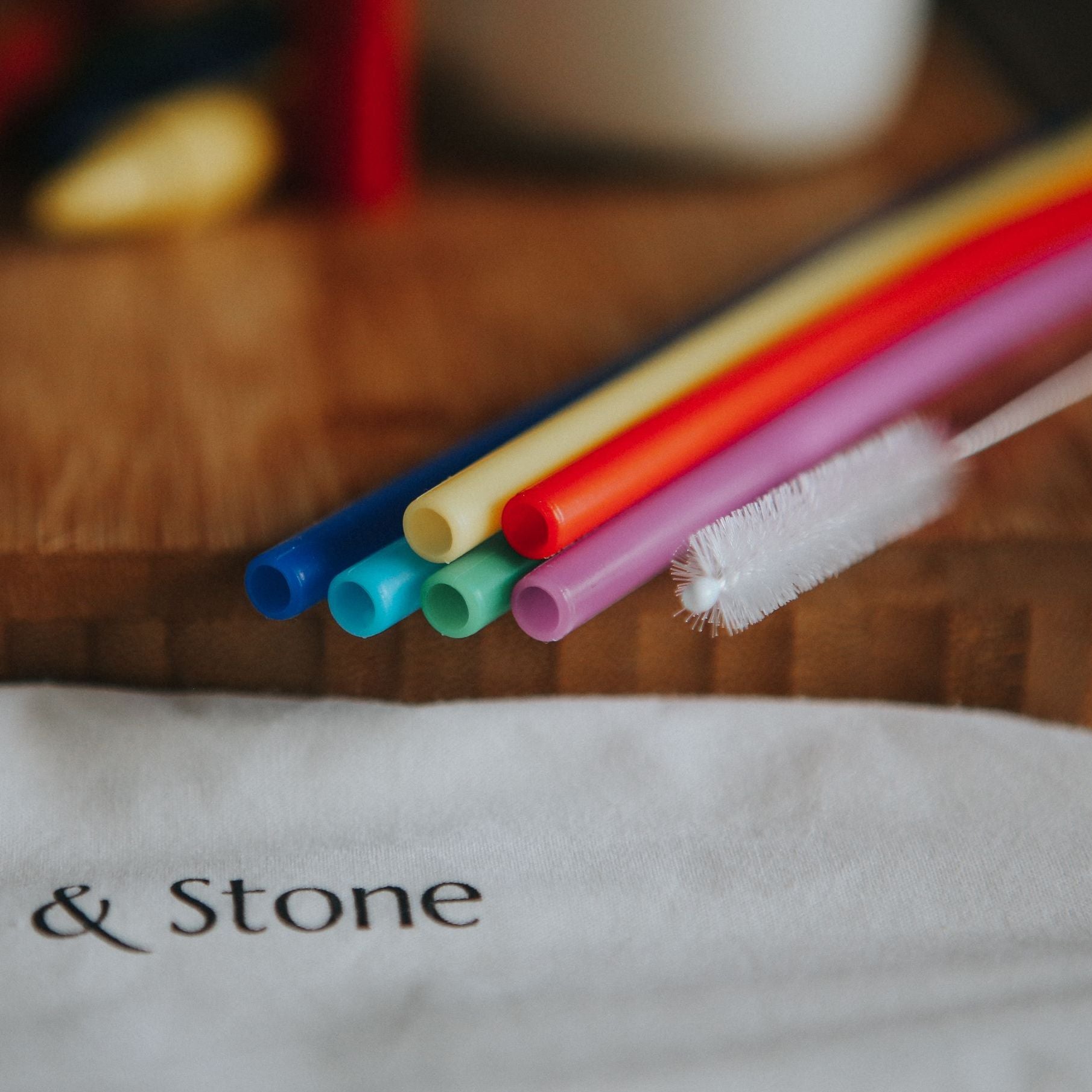 Set of six reusable silicone drinking straws from Wild And Stone, flexible and eco-friendly for beverages.