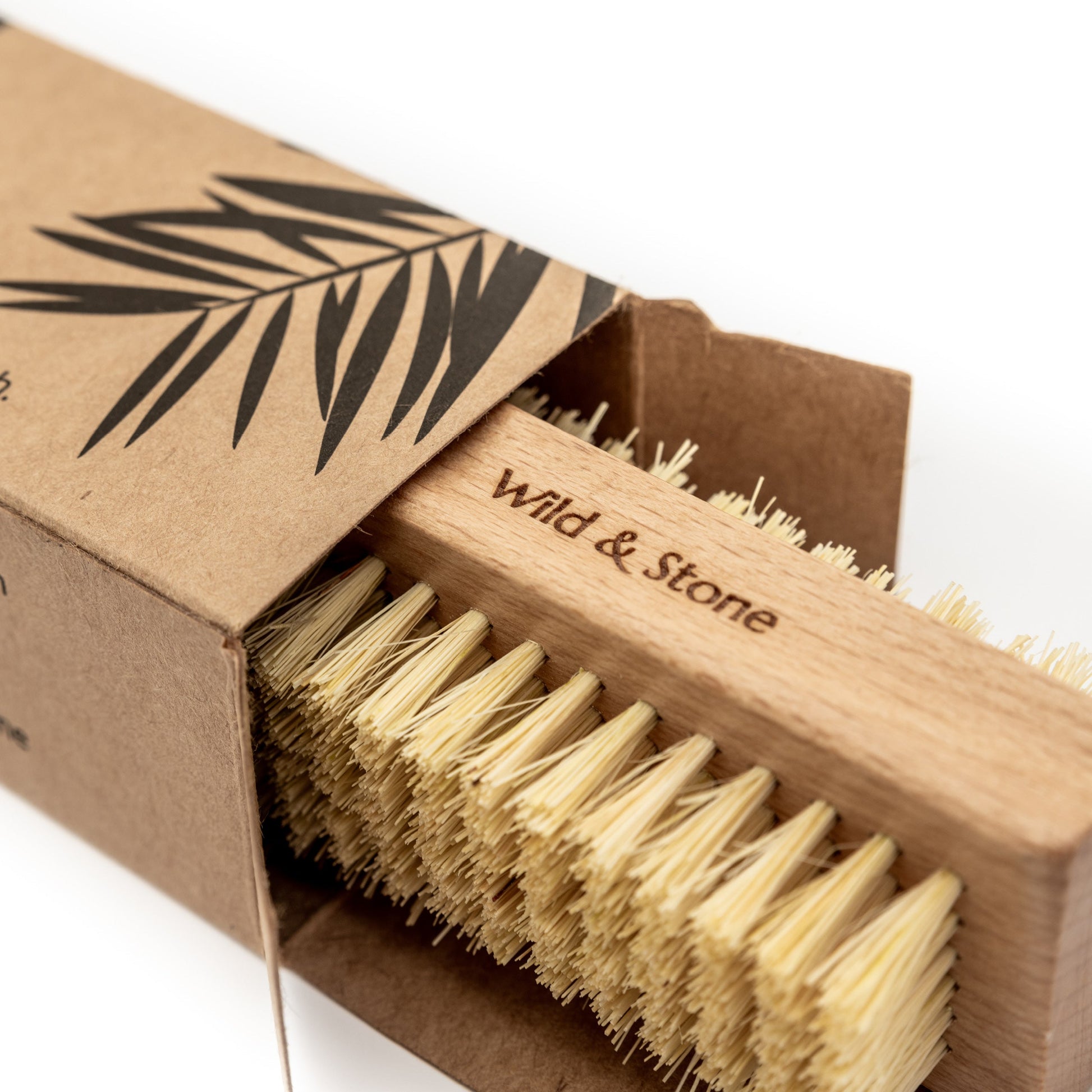 Wild And Stone biodegradable natural bristle nail brush with wooden handle, ideal for effective nail cleaning and grooming.