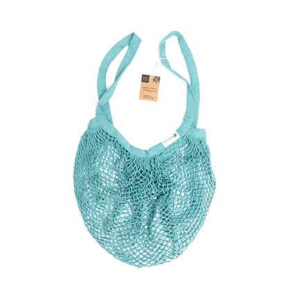 Organic cotton blue crochet tote bag by Wild And Stone, showing a spacious, lightweight bag with sturdy handles and intricate crochet design.